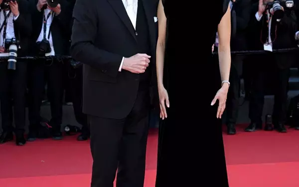 John Travolta's Cannes Style Evolution: From Acting Icon to Beret-Clad Director