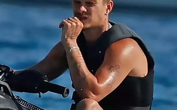 Romeo Beckham Embodies Father's Noughties Fashion, Showcasing Physique During Ibiza Getaway