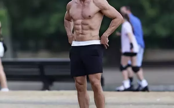 Kim Kardashian's Hairstylist Chris Appleton Flaunts Muscular Physique in London Park Ahead of 'Strictly' Debut