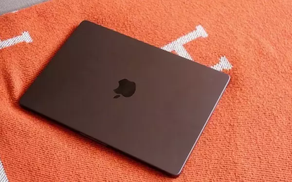 Apple's Revised MacBook Strategy: Focus on OLED, Foldable & Larger Models Shelved