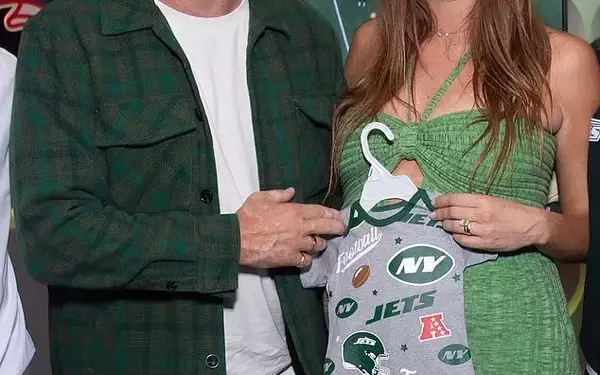 Jon Hamm and Anna Osceola's Joyful Outing to Green Bay Packers Game with Baby Onesie