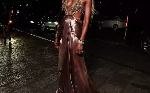 Naomi Campbell Dazzles in Metallic Gown at Milan Fashion Week Amid Relocation Reports