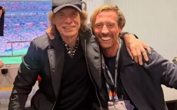 Football Star Peter Crouch Meets Rock Legend Mick Jagger at England Game