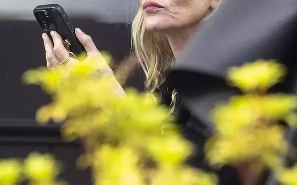 Kate Moss Steps Out Solo Amidst Sister Lottie's Candid Revelations on Their Strained Relationship